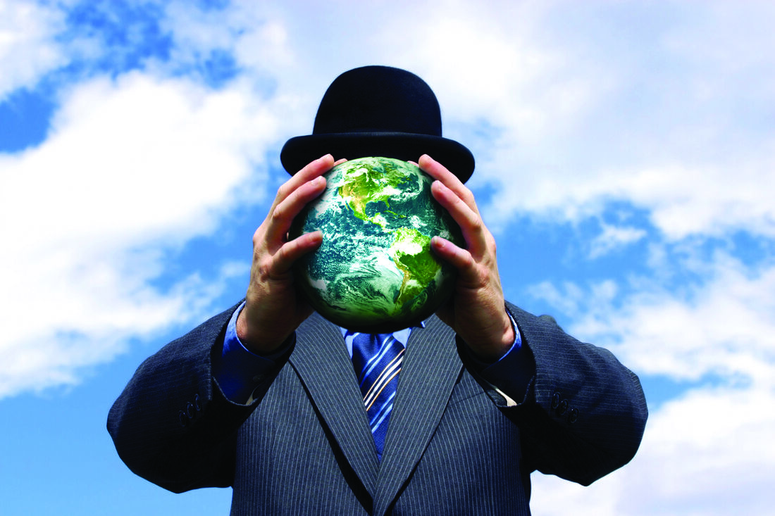 Discreet professional holding a globe — Frizell Group's global investigative perspective